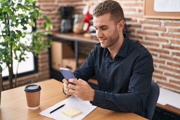 Young caucasian man business worker using smartphone working at office