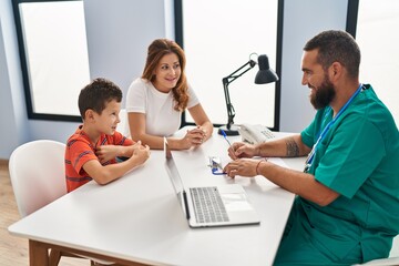 Family having medical consultation at clinic