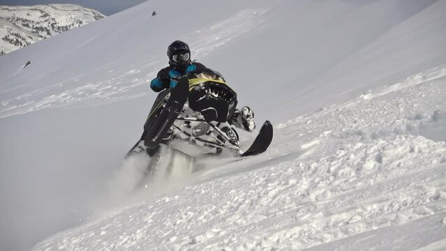 snowmobile pro. very cool riding on a snow motorcycle. for advertising winter outdoor activities and travel. 500FPS PRORES 422. slow motion