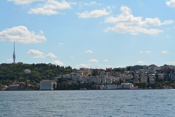 Istanbul water view, mansion, boats, sky and clouds