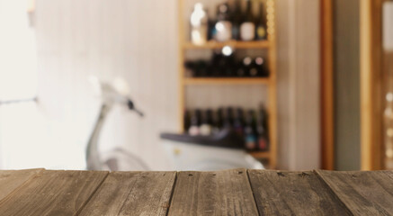 Wood top table with Blur coffee shop or cafe restaurant with abstract bokeh light image background....