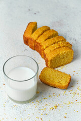 crispy cornbread with a glass of milk on a white background
