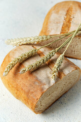 loaf of bread with wheat germ on white background