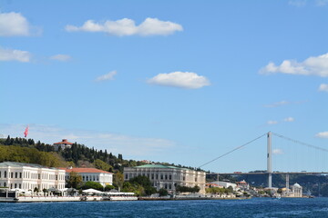 Fototapeta na wymiar Istanbul water view, mansion, boats, sky and clouds