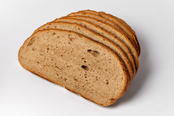 sliced pieces of black bread on a white background