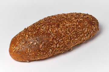 black bread with sesame seeds and seeds on a white background