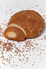 sliced round bun with seeds on white background