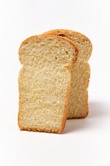 two pieces of cornbread on a white background