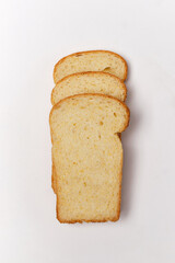 three pieces of cornbread on a white background