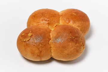 four buns fastened together on a white background