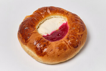 cheesecake with cottage cheese and jam on a white background, close view
