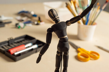 terrifying black figure of halloween, crafts table background
