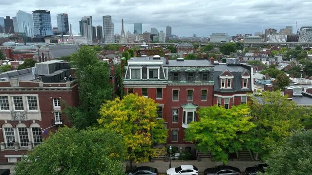 Expensive homes in Boston Massachusetts. Zakim Bunker Hill Bridge visible. Aerial view in autumn.