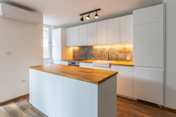 New modern kitchen. New home. Interior photography. Wooden floor.