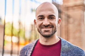 Fototapeta premium Young man smiling confident standing at street