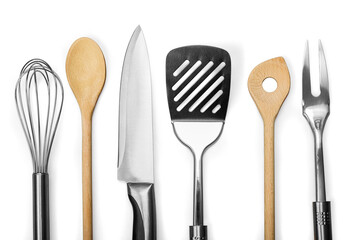 Set of modern steel kitchen utensils on wooden table - Powered by Adobe