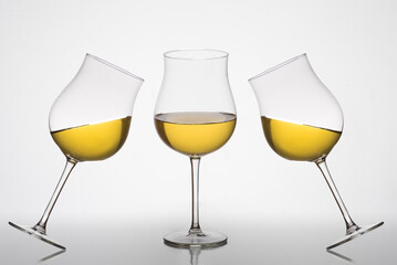 three glasses of white wine, tulip glass, oenology, wineries.