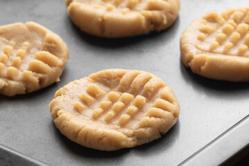 Ready to bake peanut butter cookie dough on baking tray