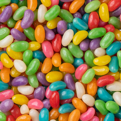Fototapeta na wymiar Closeup top view of colorful jelly beans. Candy backdrop