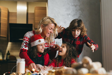 Family portrait. Preparing food together having wonderful time and smiling