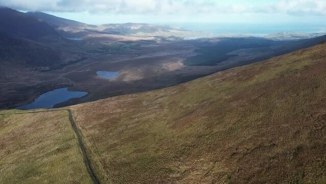 4K aerial over the Dingle Peninsula, County Kerry, Ireland at the beautiful Conor Pass, 2022