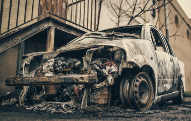 Fototapeta na wymiar car burned in the city - Close up