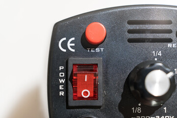 control buttons on the Studio flash on a white background. Compact flash designed for work in the studio and on the road for shooting portraits and photos on documents.