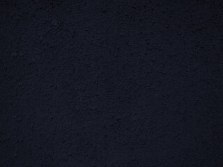 Old wall with irregular pattern. Harsh surface in black tones. Grunge background best for wallpaper. 