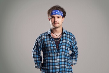 Young man posing on gray background