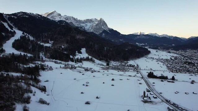 4K aerial of Garmisch Partenkirchen and the Zugspitz and Alpspitz in the alps of Bavaria, Germany, 2022