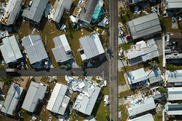 Badly damaged mobile homes after hurricane Ian in Florida residential area. Consequences of natural...