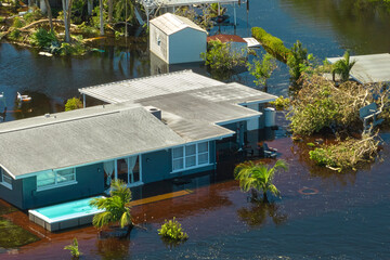 Flooded house by hurricane Ian rainfall in Florida residential area. Consequences of natural...