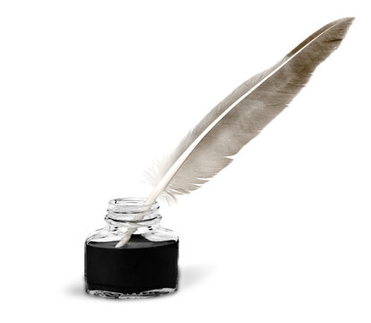 Feather quill pen and glass inkwell isolated on a white background