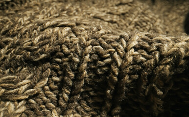 Knitted warm wool fabric texture. Close-up.