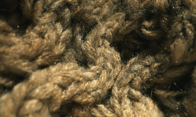 Knitted warm wool fabric texture. Close-up.