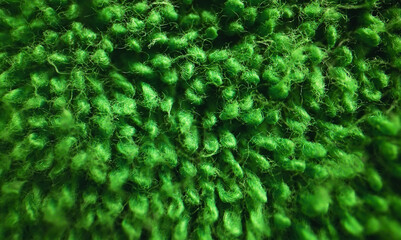 Texture of green soft terry towel textile.