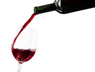 Pouring red wine in a glass isolated on white background