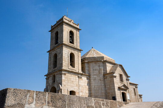 Portugal, near Mondim de Basto and Vilar de Ferreiros: Famous church Santuario de Nossa Senhora da Graca on Portuguese Monte Farinha with steeple, bells, stairs, blue sky - concept religion tourism