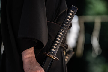 Fototapeta na wymiar 日本刀を構える人物（Demonstration of Japanese sword）