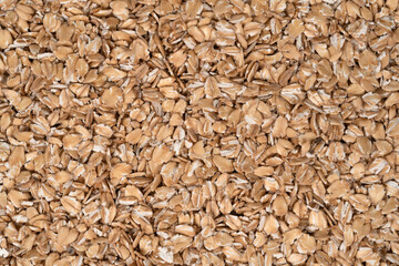 Oat flakes texture background, close up. oatmeal. barley flakes. rolled oat