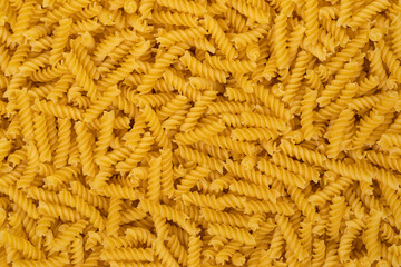 Spiral pasta background texture closeup