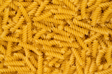 Spiral pasta background texture closeup