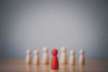Red figure of a man made of wood,  Leadership, individuality and standing out of crowd concept....