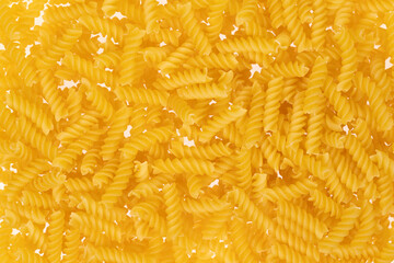 Spiral pasta on white background. texture closeup
