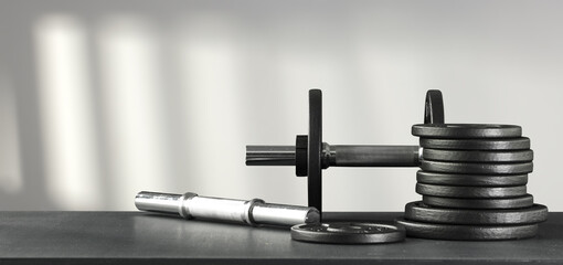 Black desk of free space and wall with shadows. 