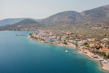 Fototapeta na wymiar Antikyra Greece, aerial drone view. Coastal village boats and beach in Boeotia