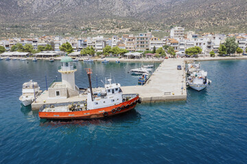 Antikyra Greece, aerial drone view. Coastal village and boats in Boeotia