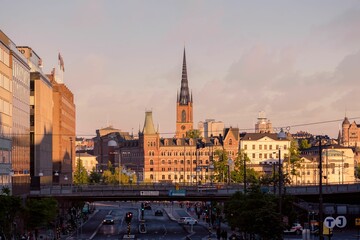 Scenic shot of the Riddarholmen Church in the background of the bridge in Stockholm, Sweden