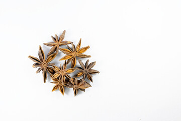 Pile of organic fresh whole star anise isolated on white background. close up.top view.
