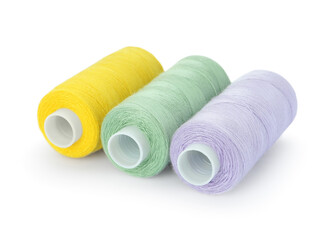 Different colorful sewing threads on white background